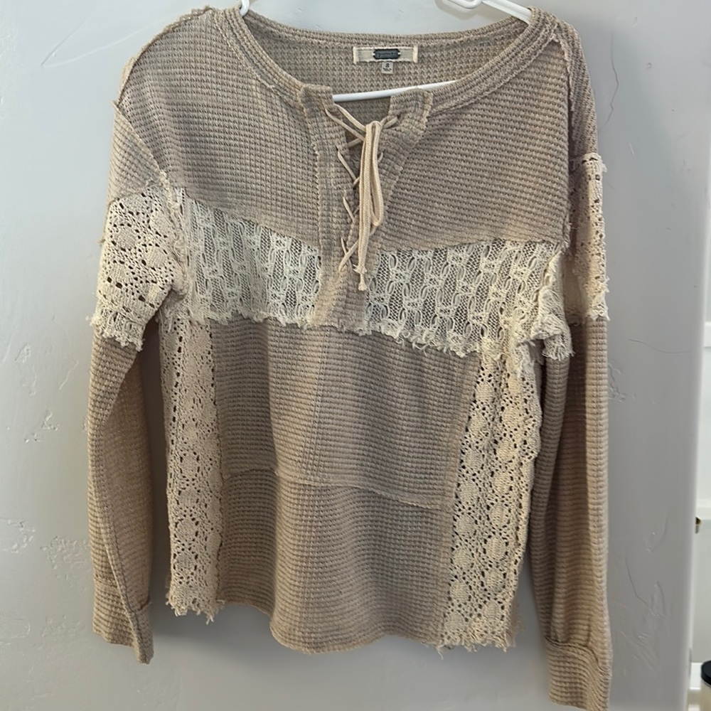 Long sleeved, light weight sweater.